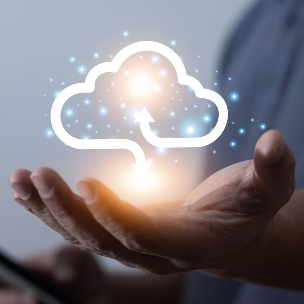 Man holding virtual cloud computing in hand concept. Cloud computing is a system for sharing, downloading and uploading large data.